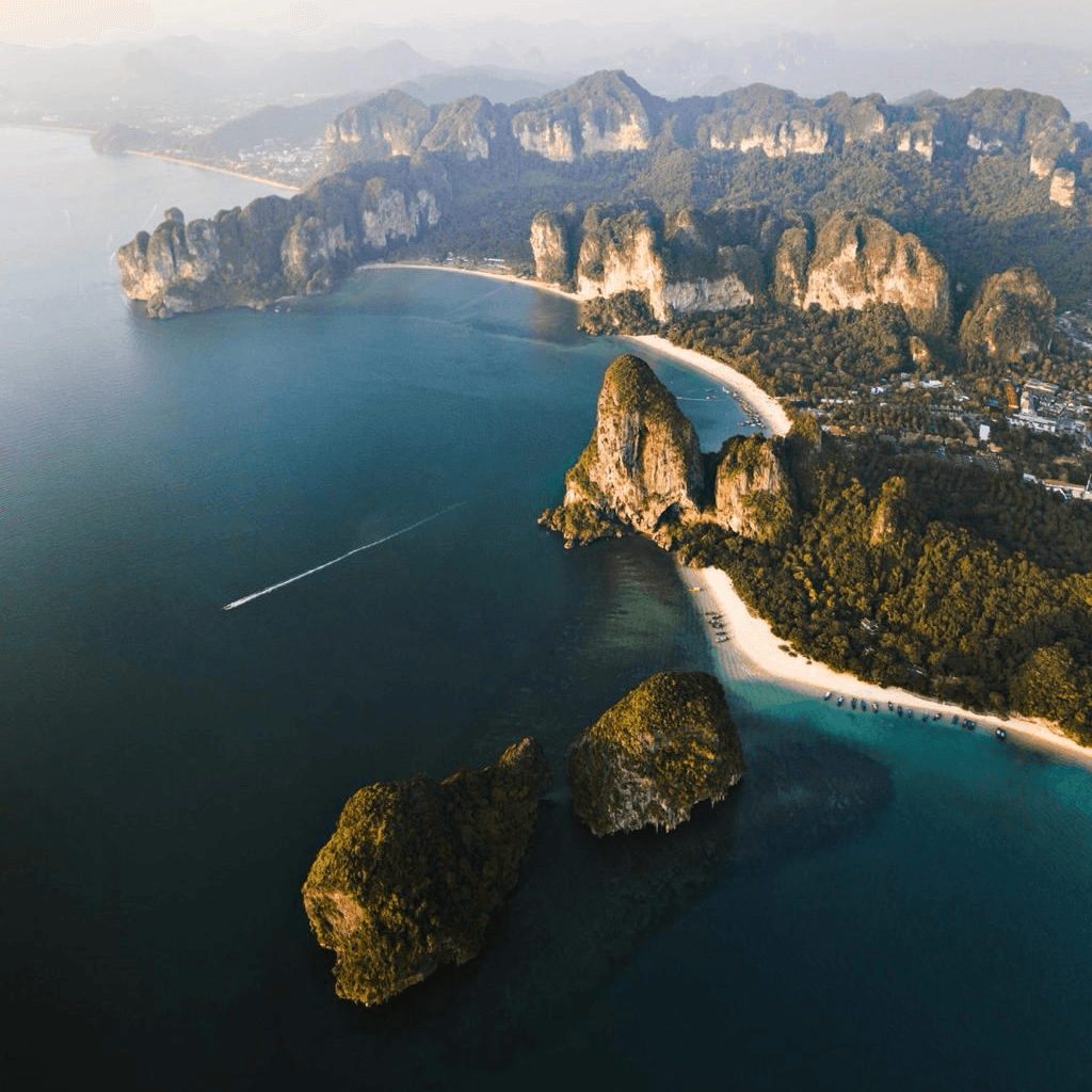 Thailand island coast with turquoise water and limestone cliffs