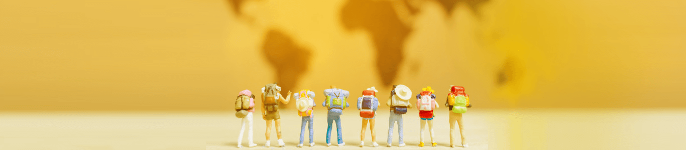 Travelers standing together with backpacks